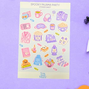 May include: A Spooky Pajama Party sticker sheet featuring various illustrations including pajamas, popcorn, ghosts, candy, books, and slippers in pastel purple, pink, and orange tones. The sheet includes the text Spooky Pajama Party and Yes And More.