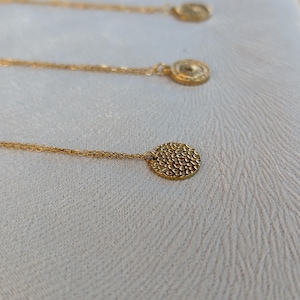 Textured gold medallion necklace for women. Round relief pendant in stainless steel. Trendy minimalist jewelry. Stainless Steel Jewelry