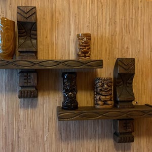 Pair of handmade carved wood mug witco style tiki shelves