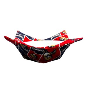 May include: A red, white, and navy blue fabric bowl cosy featuring the Florida Panthers logo. The cosy is designed to hold a bowl and keep food warm. The fabric has a repeating pattern of the team logo and name.