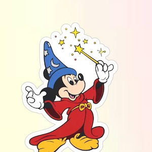 May include: A die-cut sticker featuring Mickey Mouse dressed as a sorcerer in a long red robe with a gold belt and a tall blue hat decorated with white stars and a crescent moon. Mickey holds a yellow magic wand, surrounded by yellow stars.