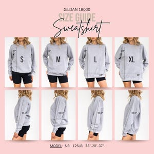 May include: A Gildan 18000 sweatshirt size guide featuring front and side views of a grey crewneck sweatshirt in sizes S, M, L, and XL. The image displays measurements in inches for length, width, and sleeve length, with model stats of 5'8, 125lb.