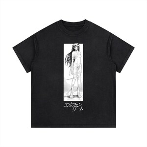 May include: Black t-shirt with a manga-style illustration of a bandaged character in a white rectangular frame. Japanese text is below the image. The shirt has a crew neck and short sleeves.