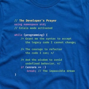 May include: A blue t-shirt with the text "The Developer's Prayer" in a colorful code-like font. The text includes programming terms and phrases, making it a great gift for programmers and software developers.