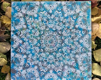 May include: Square artwork with a blue and white mandala design. The artwork features a central circular pattern with repeating text that reads "MIND". The background has a watercolor effect with shades of blue, green, and purple.