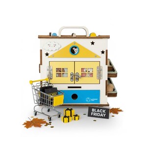 May include: A wooden toy house with a yellow roof, blue drawer, and interactive features. A miniature shopping trolley with black bags, yellow gift boxes, and a "BLACK FRIDAY" sign are in front of the house.