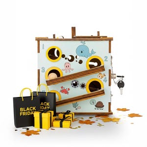 May include: Wooden toy with a light blue background featuring sea creatures. The toy has a ball track, numbered holes, and a lock with a key. Black shopping bags with "BLACK FRIDAY" text and yellow gift boxes are in front.