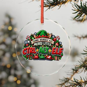 May include: A round, clear glass Christmas ornament hanging from a red ribbon. The design features a green elf hat, candy canes, and the text "HAVE YOURSELF A MERRY LITTLE CTRL+ALT+ELF" above three computer keys labeled CTRL, ALT, and ELF.