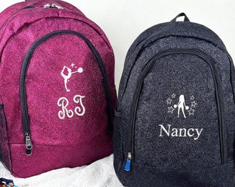 Mochila de animadora personalizada con purpurina y nombre bordado, ideal como regalo para equipos de gimnasia.
