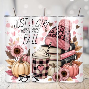 May include: A white tumbler with a fall theme, featuring the text "Just a Girl Who Loves Fall." The design includes pumpkins, a coffee cup, a pink and leopard print hat, books, and flowers. The tumbler has a silver lid and straw.