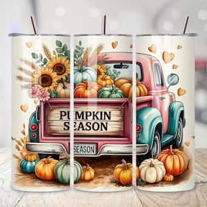 May include: A stainless steel tumbler featuring a pink vintage truck filled with pumpkins, sunflowers, and the text "PUMPKIN SEASON." The design includes orange and green pumpkins, and yellow sunflowers, perfect for fall.