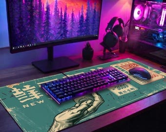 May include: A gaming setup featuring a desktop computer, monitor, and peripherals. A teal mousepad with a baseball-themed graphic and Japanese text supports a keyboard and mouse. The keyboard has blue and purple backlighting.
