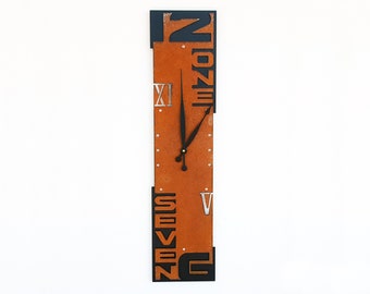 Modern Industrial Wall Clock | Vertical Rust and Black Design with Cut-Out Numbers | Unique Home Décor | Outnumbered VII