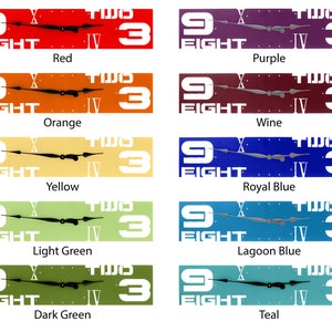 May include: A set of nine clocks with different colored backgrounds. The clocks all feature the same design with the numbers 9, 3, and the words "FIGHT" and "TWO" on the face. The colors of the clocks are red, orange, yellow, light green, dark green, purple, wine, royal blue, lagoon blue, and teal.