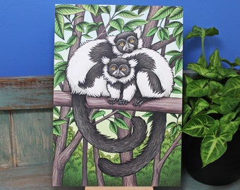 May include: A black and white illustration of two black and white ruffed lemurs sitting on a branch in a green leafy tree. The lemurs are looking at the viewer.