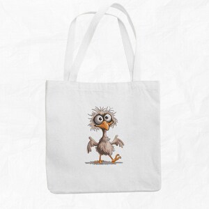 May include: A white tote bag with a cartoon illustration of a bird with large eyes and a funny expression. The bird is brown and white with a yellow beak.