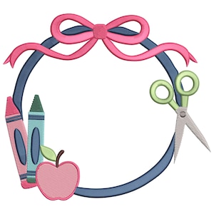 May include: A circular design featuring school-themed elements. A pink bow sits atop a dark blue ring, with a pair of green scissors on the right. Two crayons and a pink apple are on the left side of the ring.