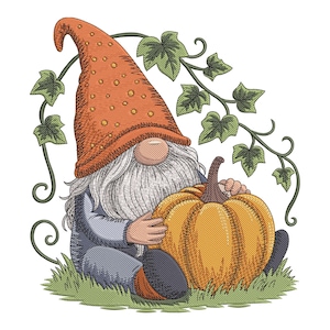 May include: An embroidered image of a garden gnome with a long white beard and an orange hat, hugging a large orange pumpkin. Green vines with leaves frame the top of the image, and the gnome sits on green grass.
