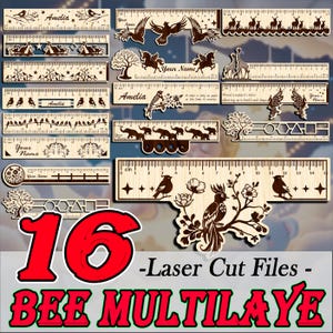 May include: A selection of 16 laser-cut wooden rulers with diverse decorative designs, such as birds, flowers, animals, and geometric shapes. Some rulers are personalized with the names "Amelia" and "Your Name". The rulers are measured in centimetres.