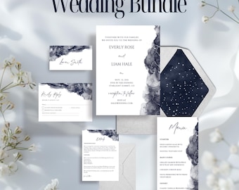 May include: A wedding invitation suite with a navy blue and white color scheme. The invitation features a watercolor design with a starry night sky. The text on the invitation reads "Together with our families, we invite you to the wedding of Everly Rose and Liam Hale, Nov. 14, 2020, Five in the evening, Starlight Summit, CO, reception to follow, RSVP at halewedding.com".