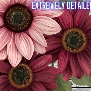 K&ouml;nnte beinhalten: Drei Sonnenblumen mit rosa und burgunderfarbenen Bl&uuml;tenbl&auml;ttern. Die Mitte jeder Blume ist braun mit einem dunkelbraunen Zentrum. Die Blumen befinden sich auf einem wei&szlig;en Hintergrund mit Holzmaserung.