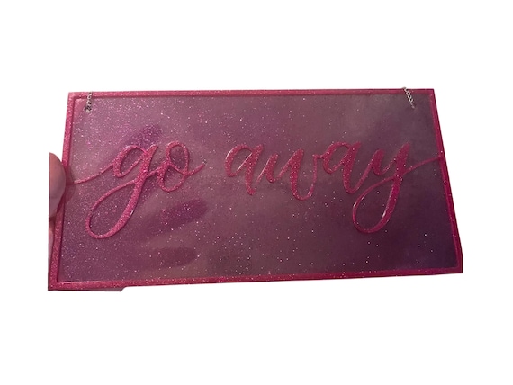 A handmade resin door sign with bold, cheeky 'Go Away' energy — actually visually striking compared to the usual laser-cut wood schlock.