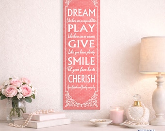 Letrero con cita inspiradora: Sueña, juega, regala, sonríe, aprecia. Decoración de pared con palabras positivas.