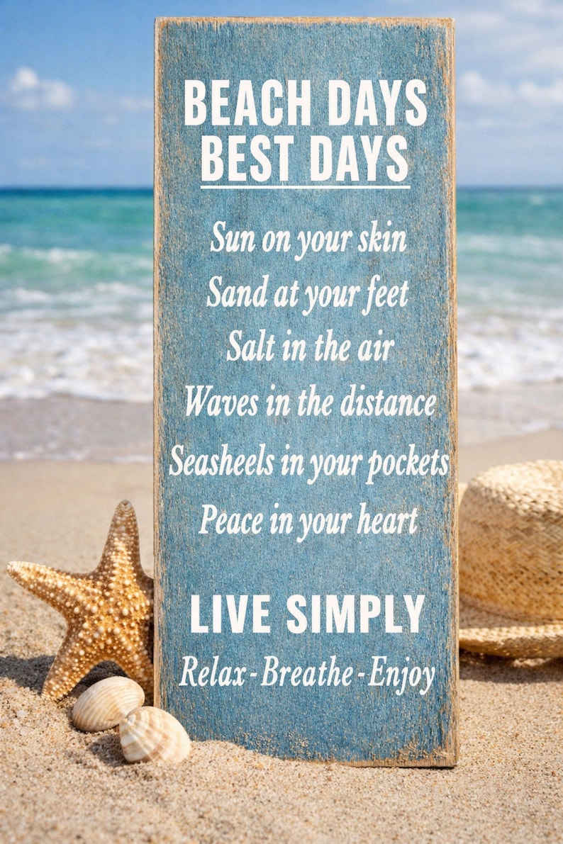 beach decor sign displayed on sand with ocean waves starfish and shells