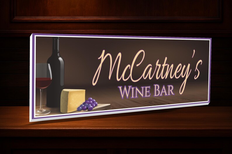 Elegant wine bar sign displayed on a home bar wall or countertop with wine decor