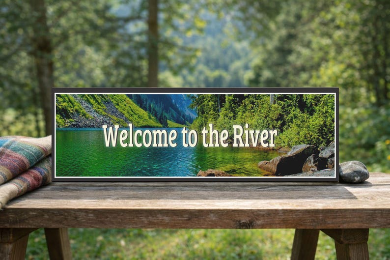 lifestyle image of river sign displayed on outdoor wooden bench with natural setting