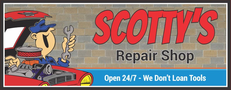Close-up of personalized repair shop sign featuring a cartoon mechanic holding a wrench next to a red car engine, with bold red and gray lettering against a block wall background.