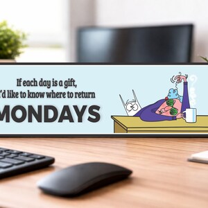 office desk decor sign showing monday humor quote in workspace setting