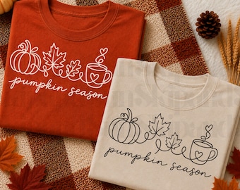 Puede incluir: Una camiseta de color óxido con un dibujo lineal blanco de una calabaza, hojas y una taza de café con el texto pumpkin season, y una camiseta beige con el mismo diseño en negro, ambas con un estilo de dibujo de línea continua.