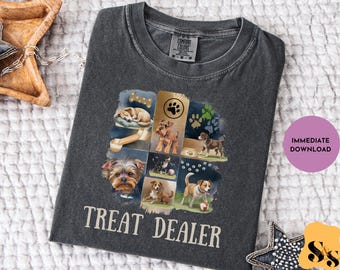 Puede incluir: Camiseta Comfort Colors gris oscuro con un collage de ilustraciones de perros y el texto "TREAT DEALER" en blanco. El diseño incluye varias razas de perros, huellas de patas y un hueso. Un círculo morado con "DESCARGA INMEDIATA" está a la derecha.
