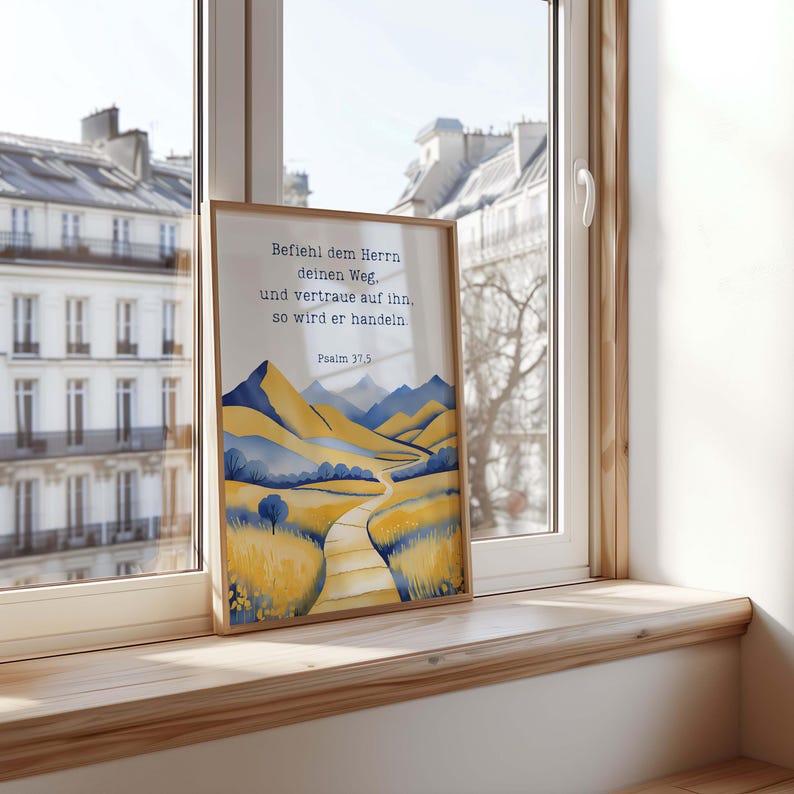 May include: A framed art print featuring a watercolor landscape with a path winding through yellow and blue hills. The print includes the text "Befiehl dem Herrn deinen Weg, und vertraue auf ihn, so wird er handeln. Psalm 37.5."
