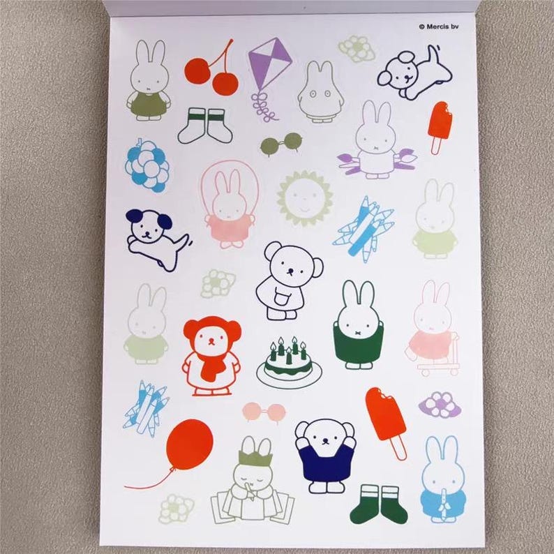 May include: A white paper sheet filled with colorful cartoon illustrations. The illustrations include bunnies, a dog, a bear, a kite, cherries, an ice pop, a cake, and other playful designs. The illustrations are outlined in various colors.
