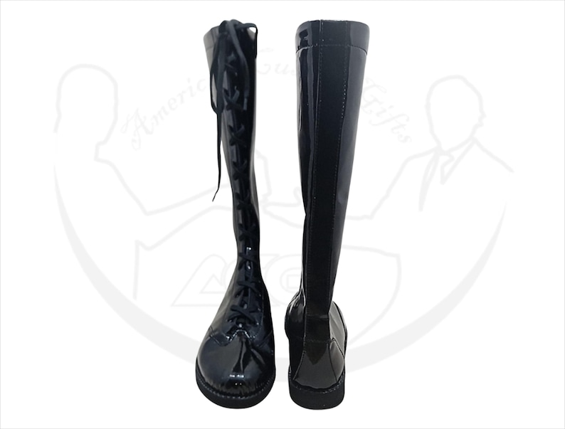 May include: Pair of black knee-high boots with a glossy finish. One boot features a lace-up design, while the other showcases a smooth, streamlined appearance. The boots have a rounded toe and a low heel, suitable for various outfits.