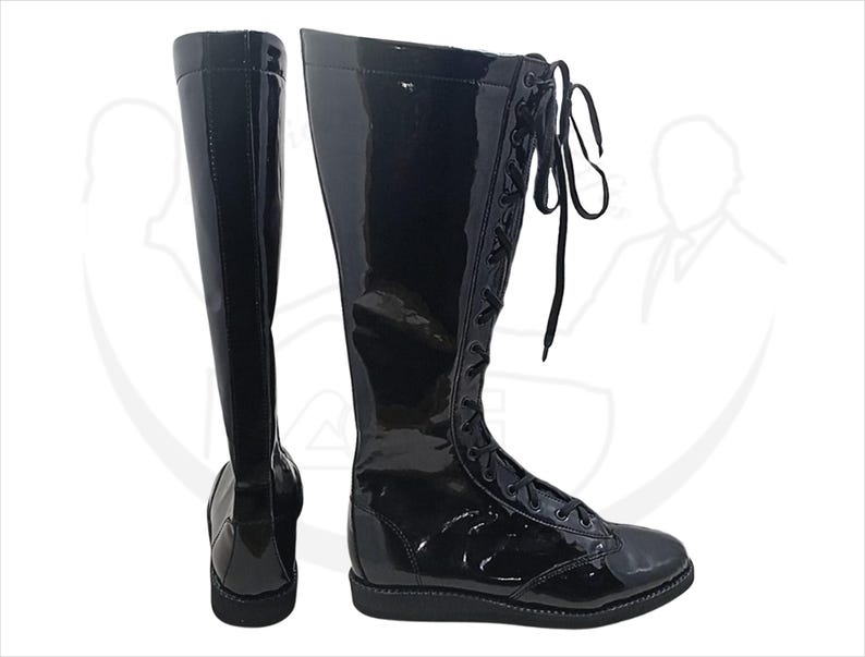 May include: Pair of tall, black, glossy boots. The boots are knee-high with a lace-up design and a rounded toe. The material appears to be patent leather or a similar shiny material. The boots are displayed against a white background.