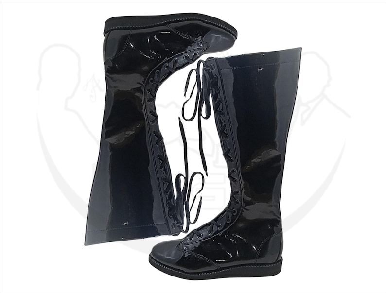 May include: Pair of black, knee-high boots with a glossy finish. The boots feature a lace-up design along the front and a flat sole. The boots are made of a shiny material and are displayed against a white background.