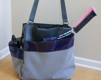 Bonjour Bag. Gray with gray net pockets and purple vinyl trim.