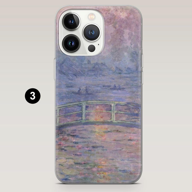 May include: Transparent phone case displaying a Monet-style artwork of a bridge over water, using soft blues, greens, and purples. The painting shows a peaceful landscape with a bridge and water lilies, creating a sense of calm.