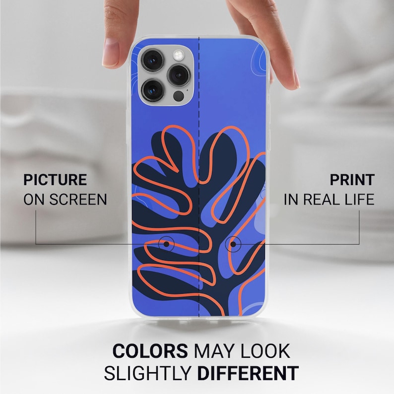May include: A clear phone case with a blue and navy abstract design featuring orange outlines. The text on the case reads "Picture on Screen" and "Print in Real Life". The bottom of the case reads "Colors May Look Slightly Different".