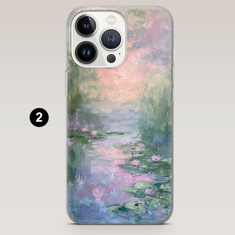 May include: Clear phone case with an impressionist painting of a water lily pond. The artwork depicts pink water lilies, green lily pads, and a colorful sky. The case has a clear border and a number 2 in a black circle.
