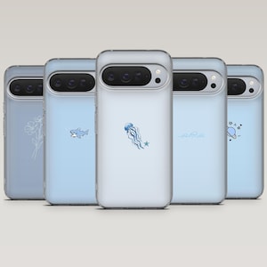 May include: A collection of five clear phone cases with various designs. The cases are light blue and feature illustrations of a flower, a shark, a jellyfish, waves, and a planet with stars. The cases are arranged in a row.
