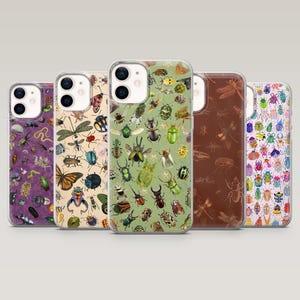 May include: Five phone cases with insect illustrations. The cases feature various insects, including beetles, butterflies, and dragonflies, in a variety of colors. The backgrounds are purple, cream, green, brown, and white.