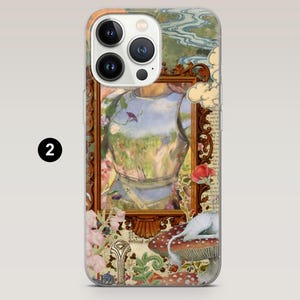 May include: A clear phone case featuring a framed illustration of a knight's armor with a landscape reflected in it. The case has a floral and mushroom design with a white cat resting on a mushroom.
