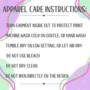 May include: White background with text: "APPAREL CARE INSTRUCTIONS:" followed by care tips. Instructions include turning garment inside out, washing cold, tumble drying on low, and avoiding bleach, dry cleaning, and direct ironing on the design.