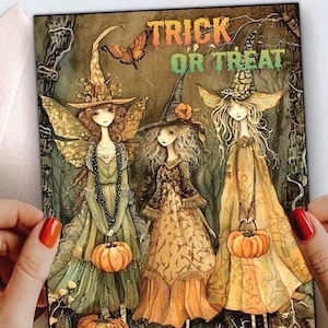 May include: A rectangular greeting card featuring an illustration of three figures in witch hats and dresses standing in a forest. The text TRICK OR TREAT is printed in the upper right corner. The figures hold orange pumpkins in a Halloween scene.