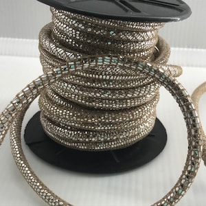5mm Stitched Round Suede Tan with Metallic Silver Print