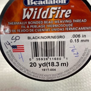 May include: A spool of black beading thread labeled "Beadalon WildFire" with the text "Thermally Bonded Bead Weaving Thread" and "20 yd (18.3 m)".